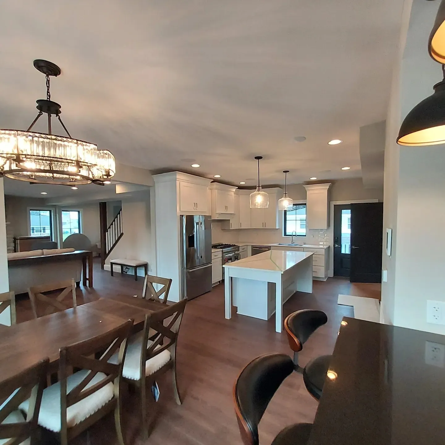 A large open kitchen with dining room table and chairs.